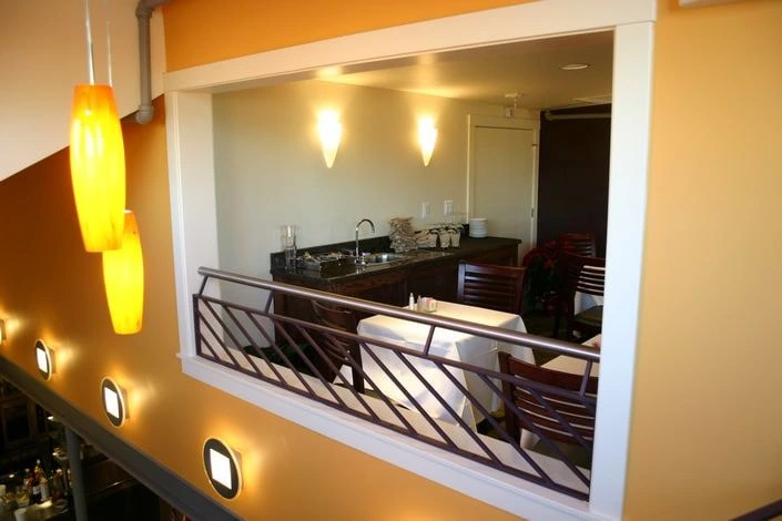 Photo of reddish-brown metal guardrail decoration in a restaurant