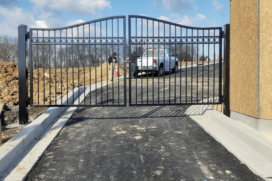 Photo of black welded metal gate in place over a road