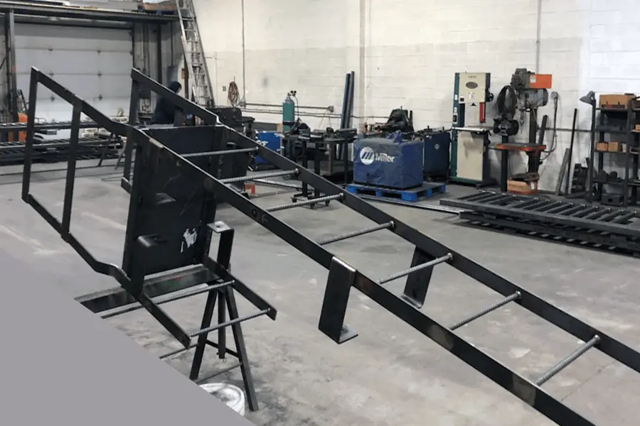 Photo of black metal fixed ladder in a workshops