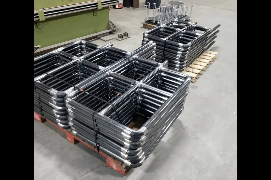 Photo of stacks of grey metal piping structures