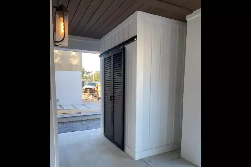 Photo of black bahama style residential metal doors