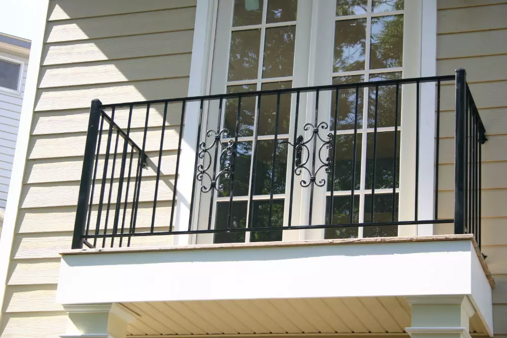 Photo of welded black metal residential railing for home balcony