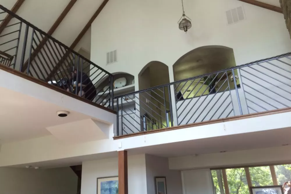 Photo of welded black metal railing for a home's second floor