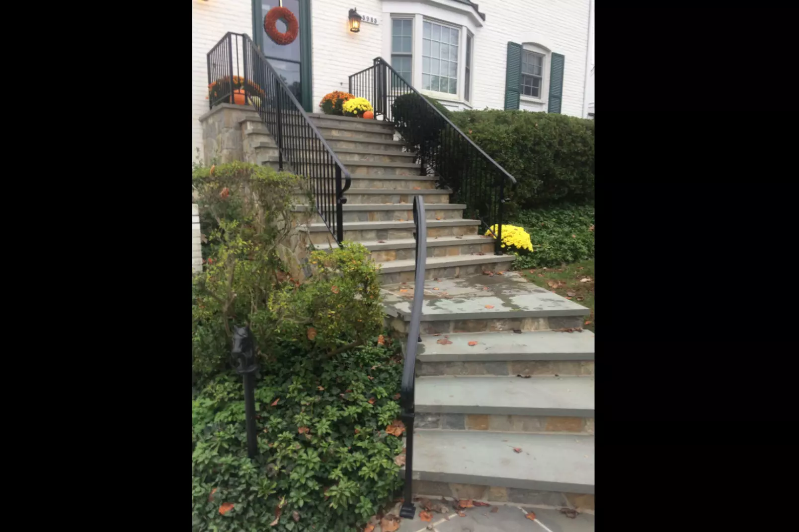 Photo of black metal railing for outdoor residential staircase and front porch