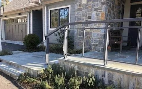 Photo of gray metal railing for outdoor stone porch and staircase