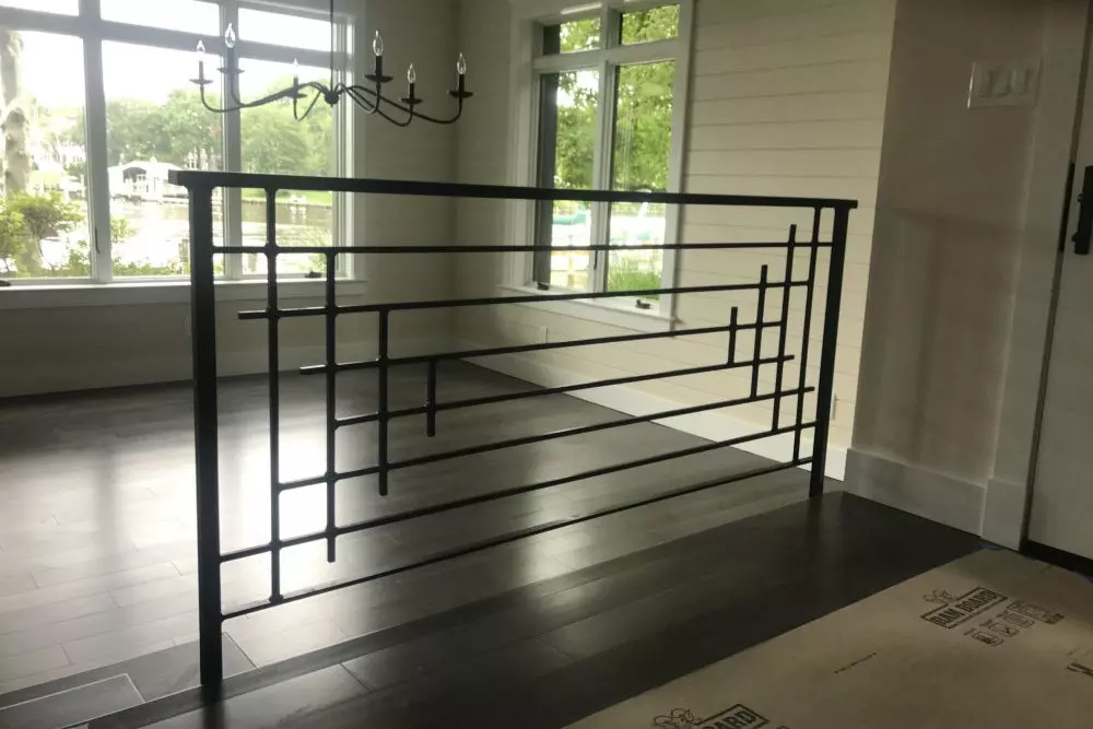 Photo of geometric black metal room divider in the front room of a home