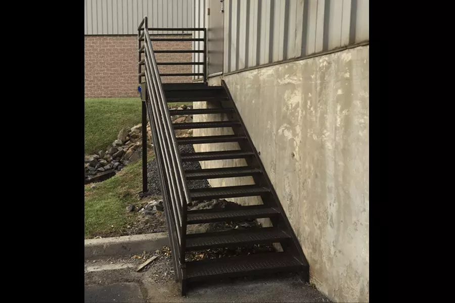 Photo of black metal outdoor stairs with black railing