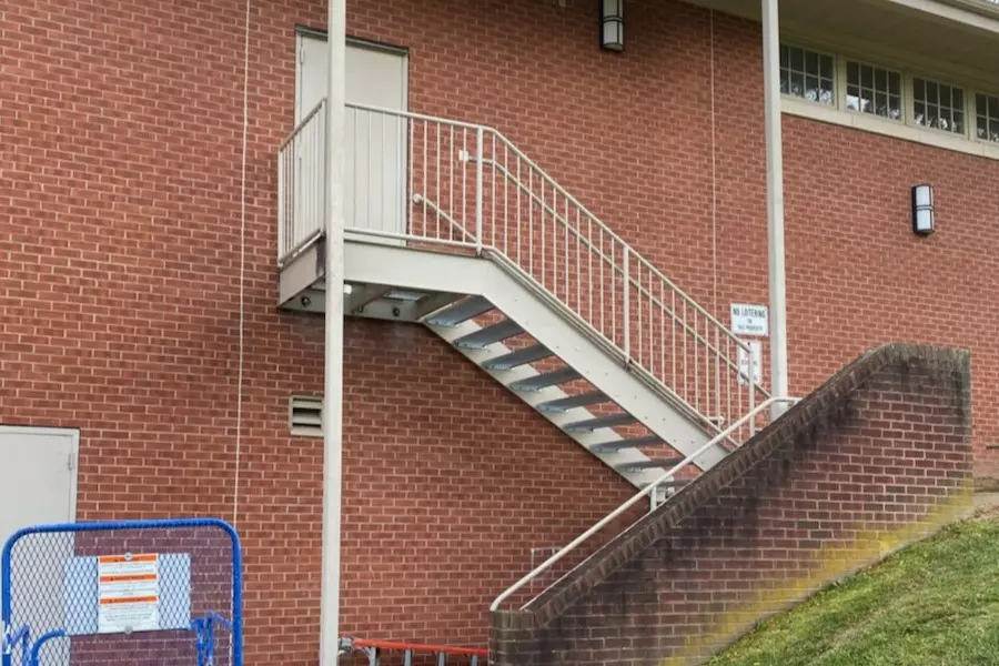 Photo of white metal staircase with white railing