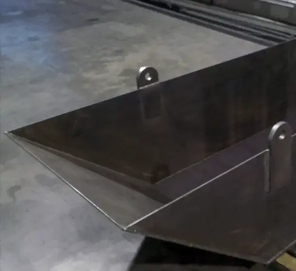 Photo of a Grey industrial metal skip pan